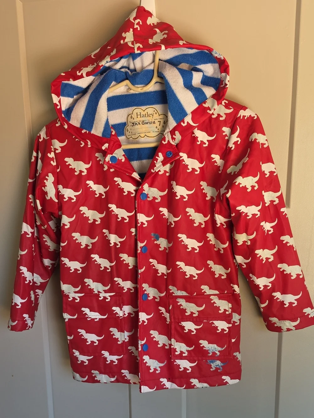 Hatley Red Raincoat with White Dinosaur Print Changes Color When Wet
